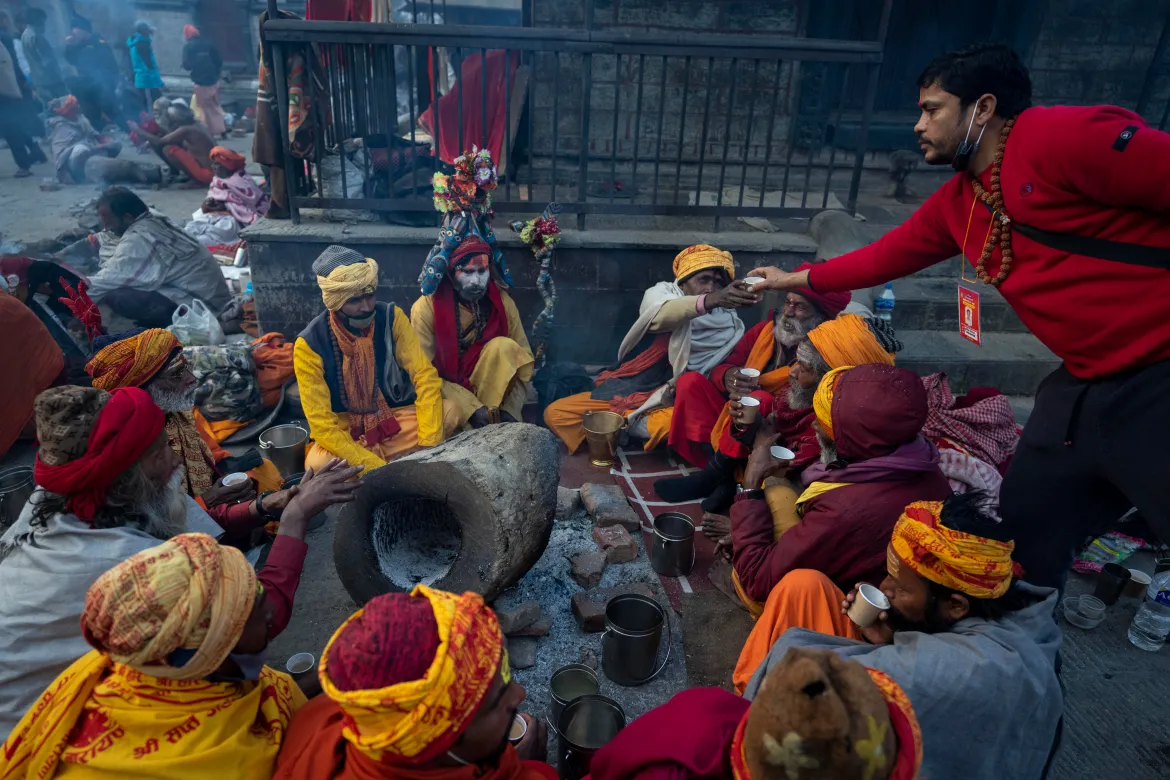Hindu Sadhu meditating at Pashupatinath Temple during spiritual pilgrimage in Nepal