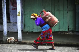 A woman carrying LPG gas